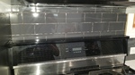 life art cabinetry white shaker door lg quartz grey subway wood tile