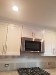 microwave hood with crown molding to the ceiling