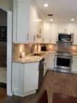 White Shaker Cabinets with stainless range