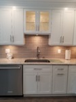 Undermount sink with glass cabinet above