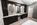 Large double sink vanity with linen towers and makeup area 